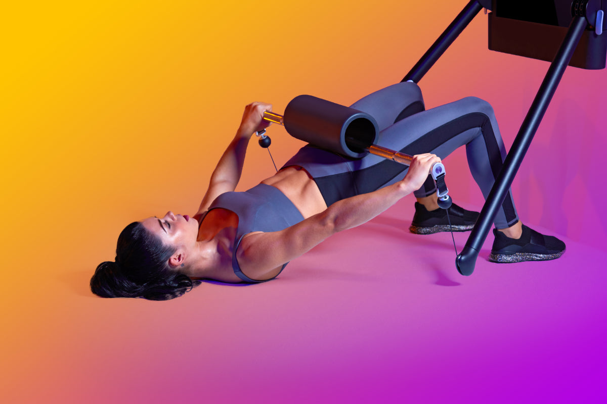 image of a woman doing a barbell glute bridge