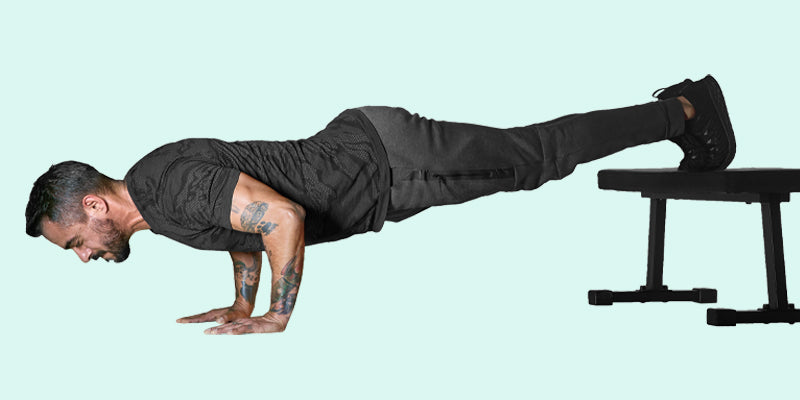 Foot-elevated pushups; chest and triceps workout at home