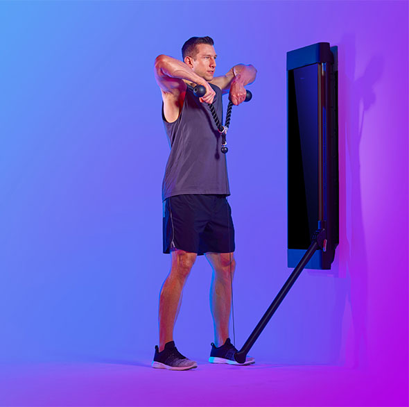 Person working out with a Tonal Resistance trainer