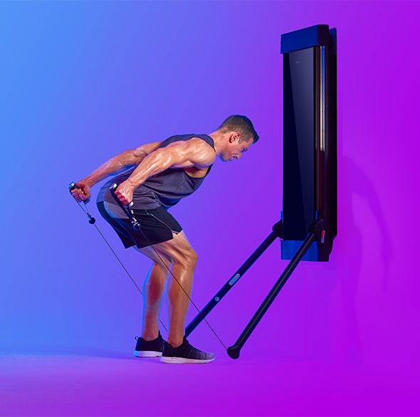 Person working out with a Tonal Resistance trainer