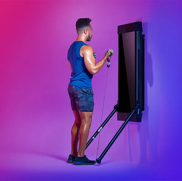 Person working out with a Tonal Resistance trainer