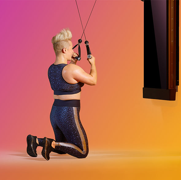 Person working out with a Tonal Resistance trainer