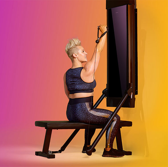 Person working out with a Tonal Resistance trainer
