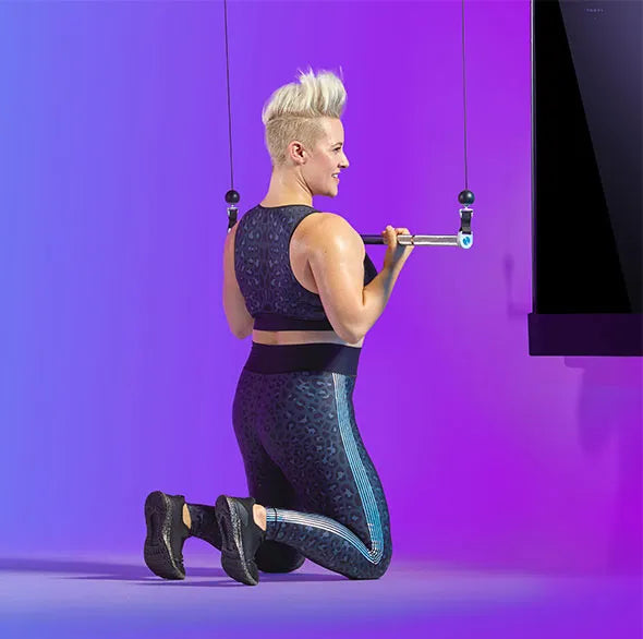 Person working out with a Tonal Resistance trainer