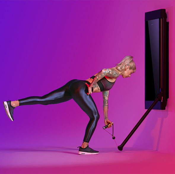 Person working out with a Tonal Resistance trainer