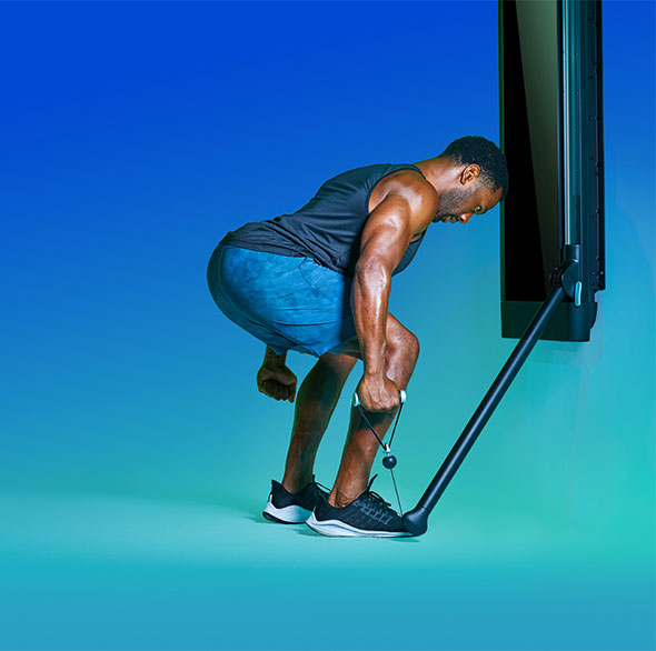 Person working out with a Tonal Resistance trainer