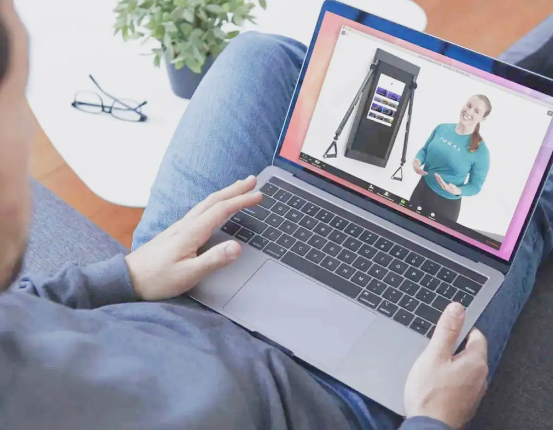 Person watching a virtual demo on their latptop