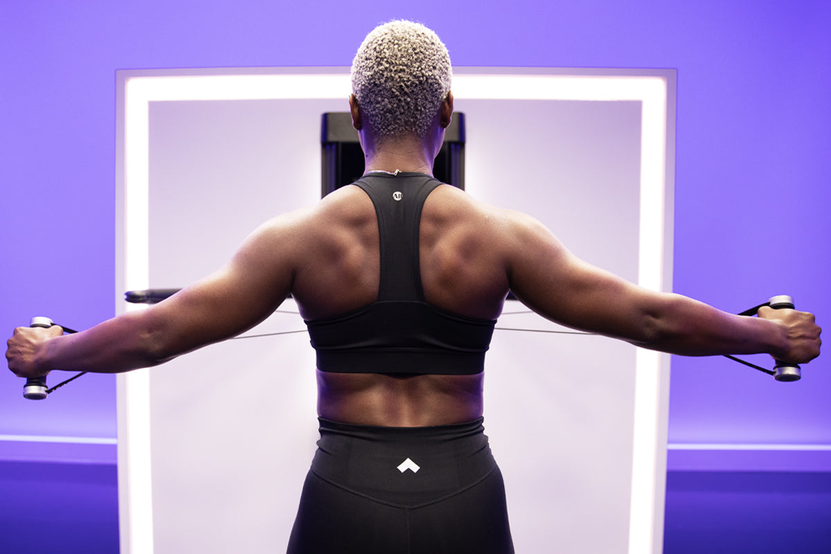 Tonal coach Tanysha Renee doing an at-home back workout.