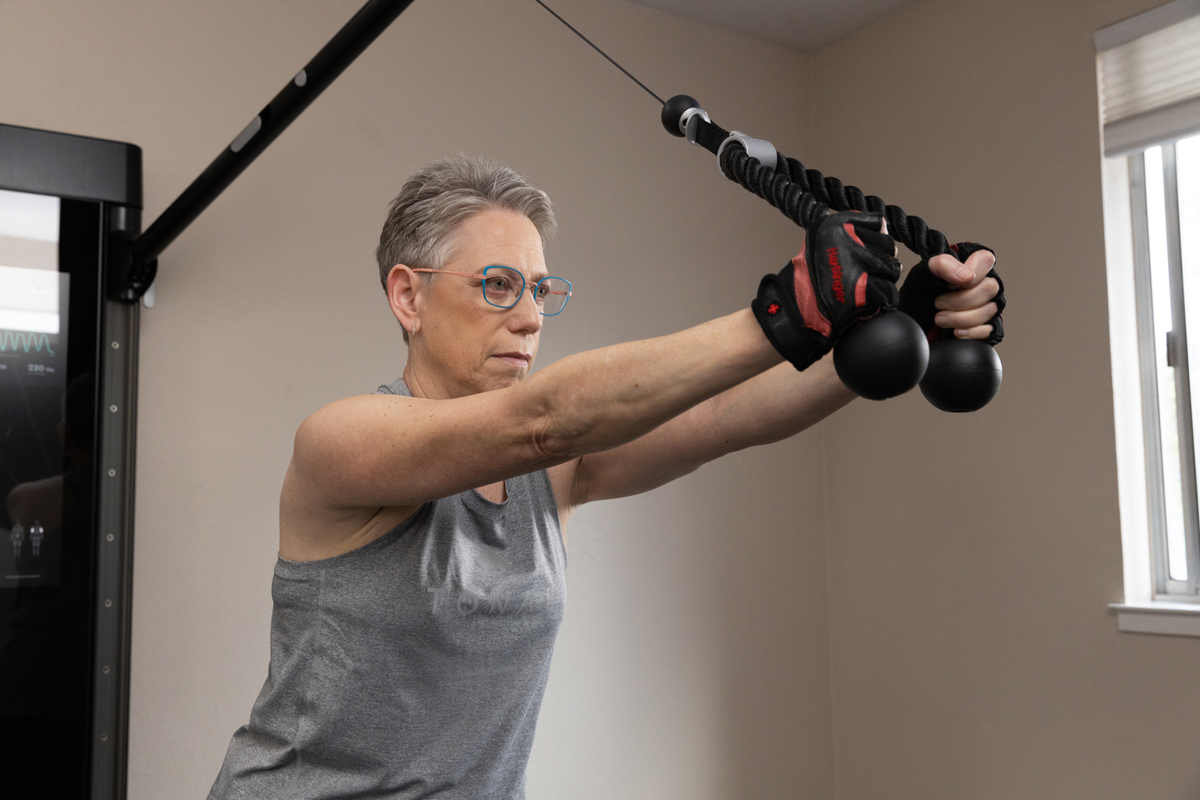 Tonal member Arlene Kraushaar working out on Tonal