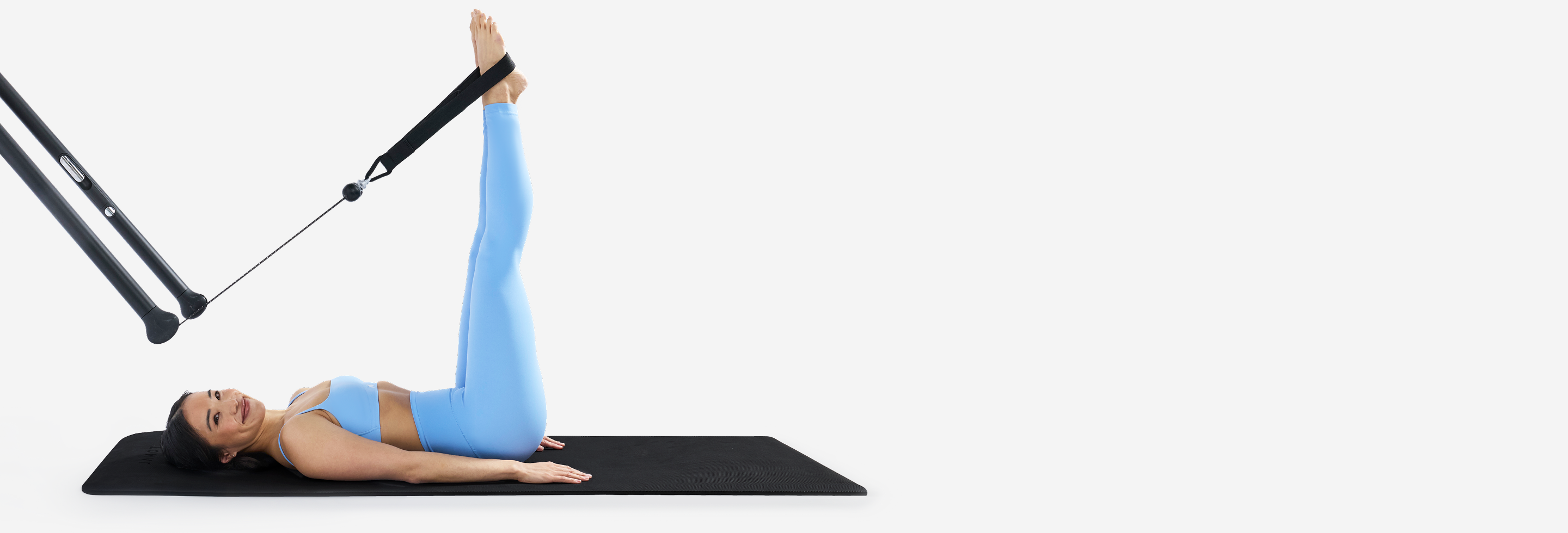 Katie Yip using a Tonal machine with Pilates Loops
