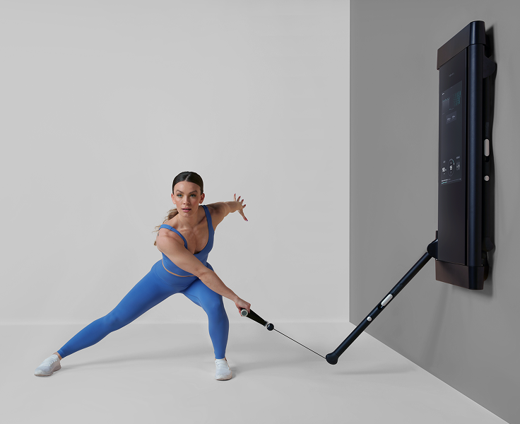 Woman performing exercises on Tonal machine