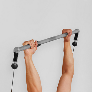 Person using Tonal Bar with Tonal machine