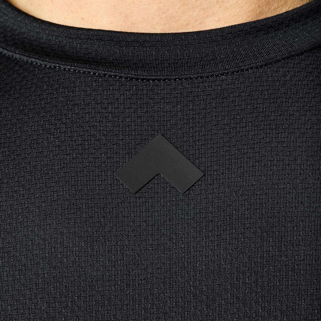 Close up of collar of black Men's Tonal Performance shop long sleeve shirt