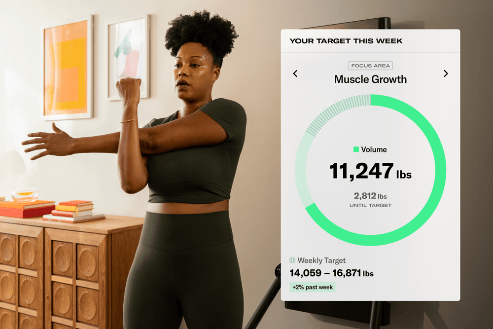 Tonal member working out and seeing her weekly target for her muscle growth goal.