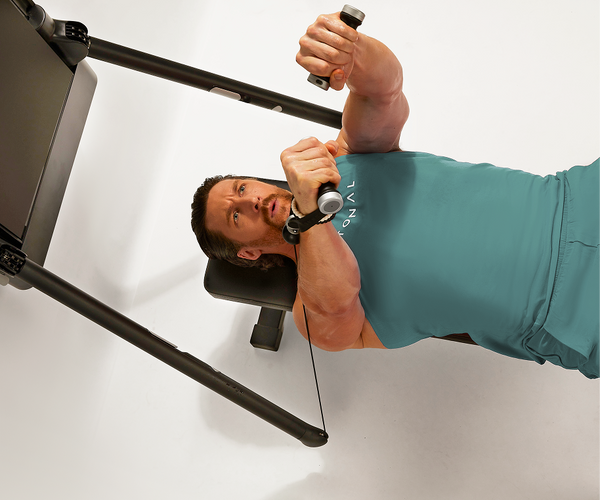 Man laying on bench doing bench press